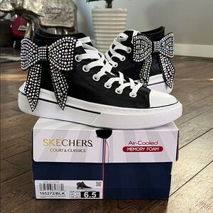 Women’s Skechers Black High-Tops with Rhinestone Bows